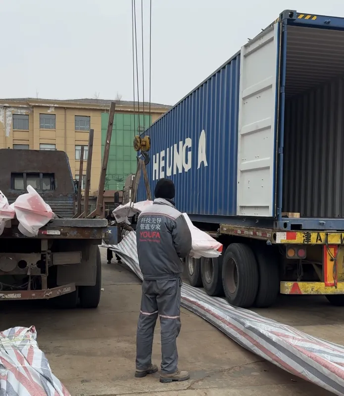 Packed carbon steel fabrication plate components for international shipment